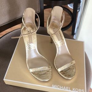 Michael Kors gold metallic embossed leather heels.